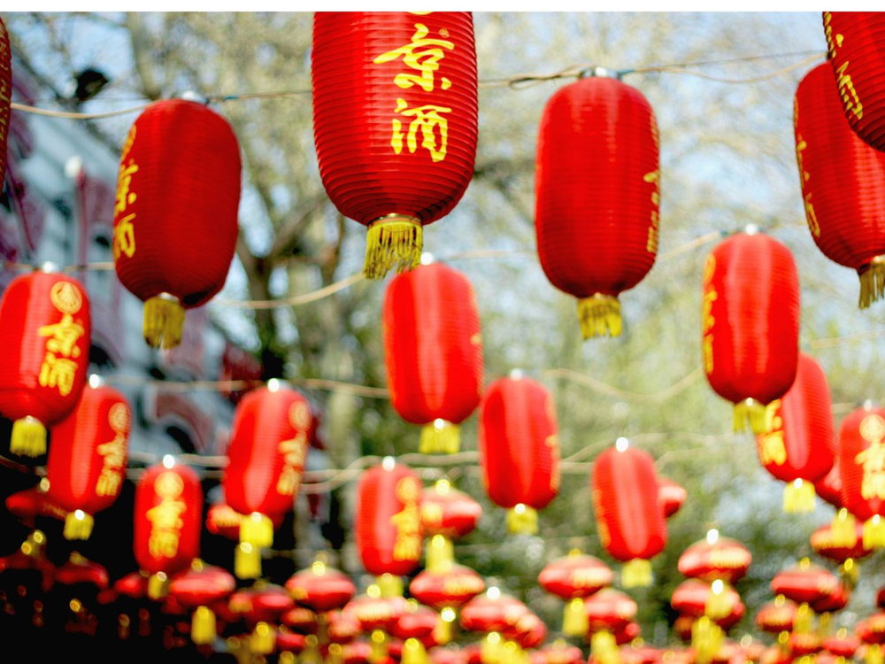 Red Chinese lanterns hanging above street in Beijing city