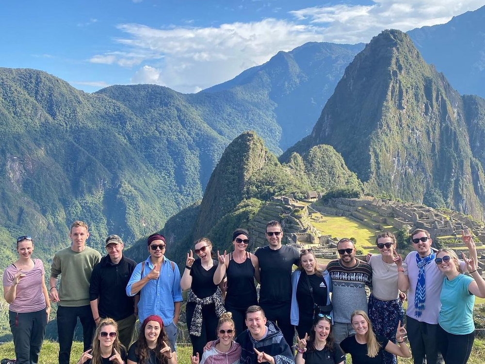 Group travellers in peru at machu picchu