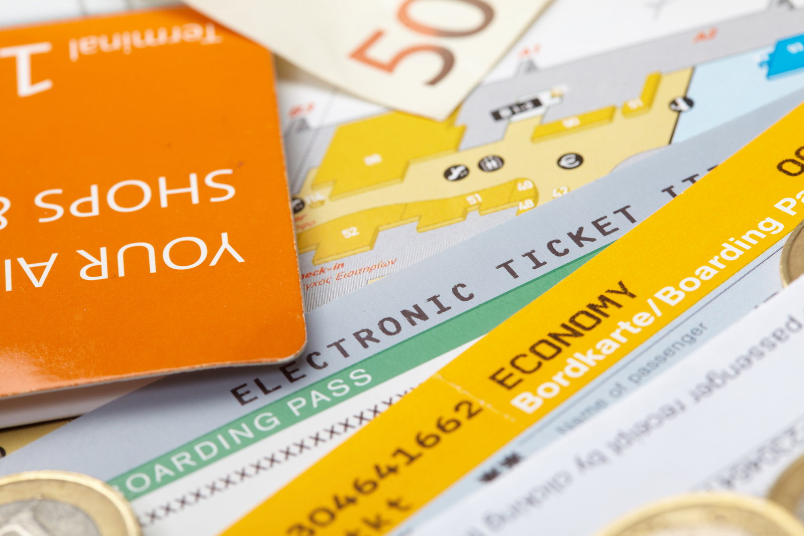 Stack of boarding tickets and travel money