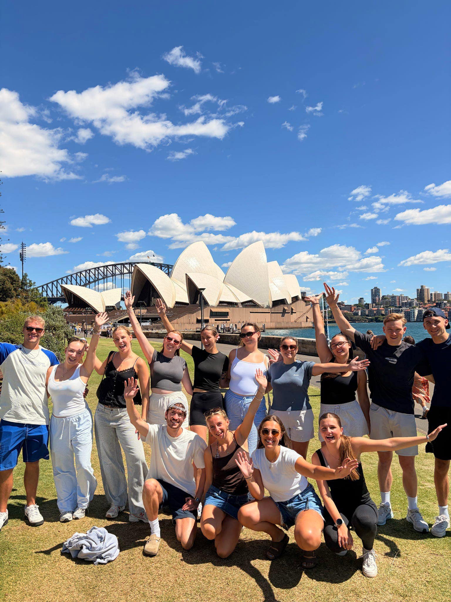 Group of travellers by Sydney Opera House in Australia