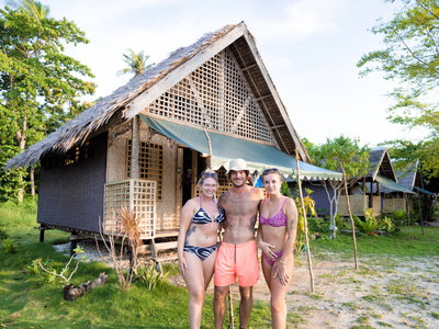 Group standing next to boat trip accommodation hunt in the philippines