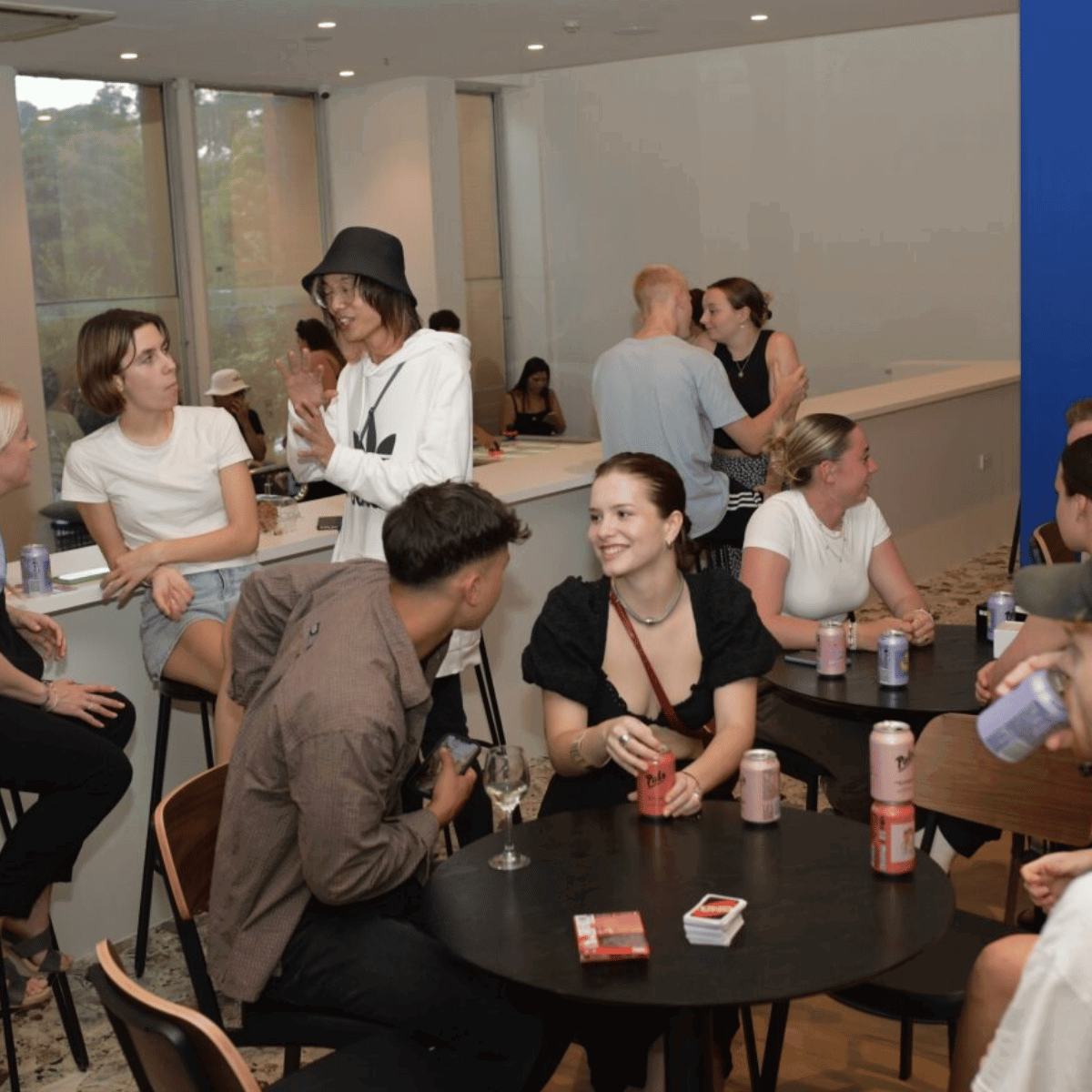 Group of travellers in communal in hostel in Melbourne