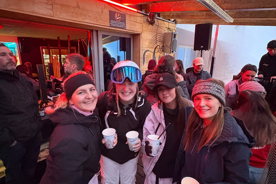 Group of travellers at apres ski bar