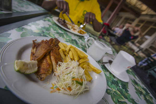 Plate of meat, salad and chips at a local African cafe