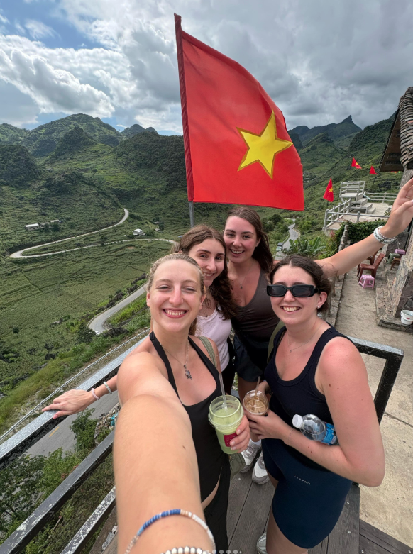 Travellers at Ha Giang Loop viewpoint in Vietnam