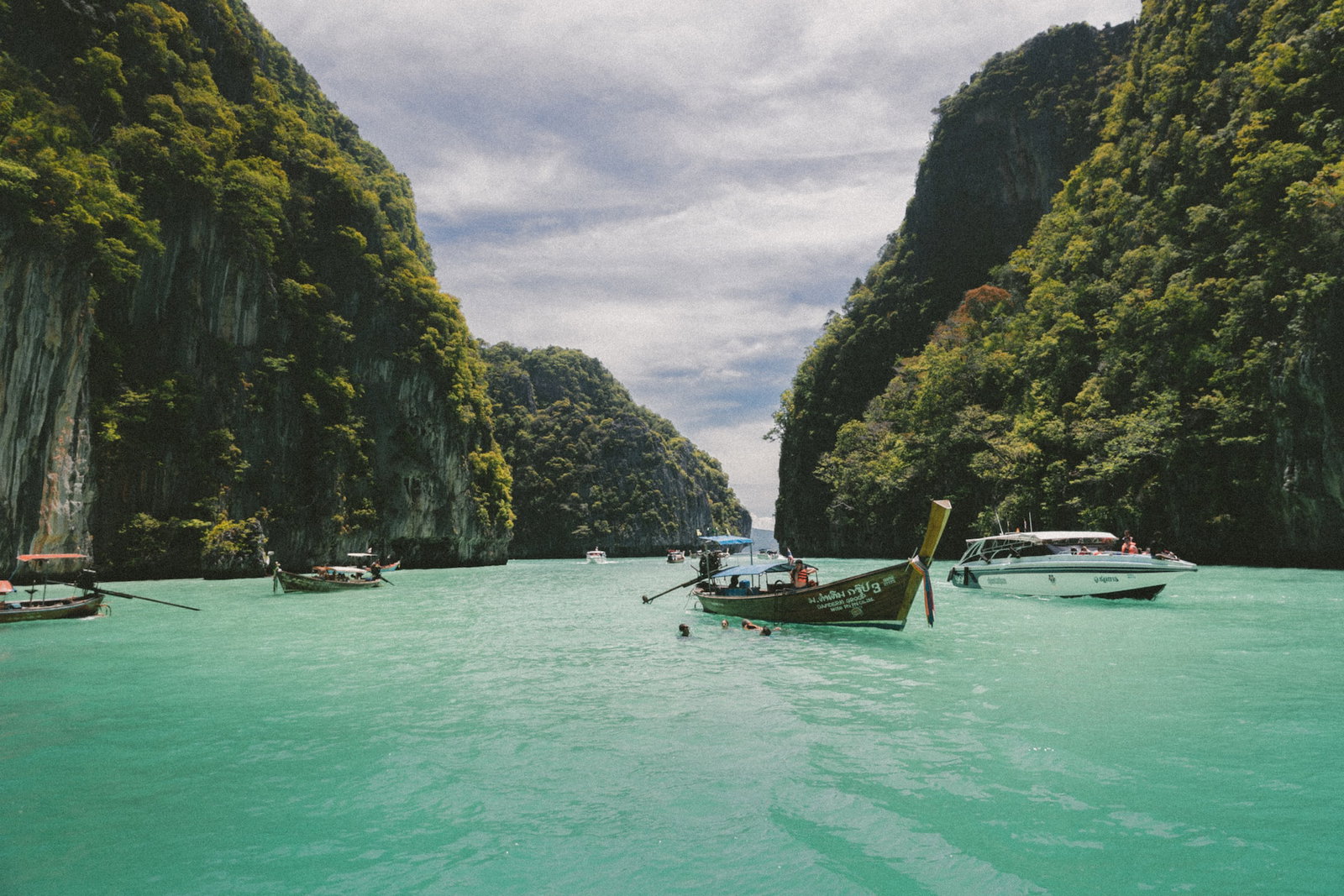 Boats in water between islands 