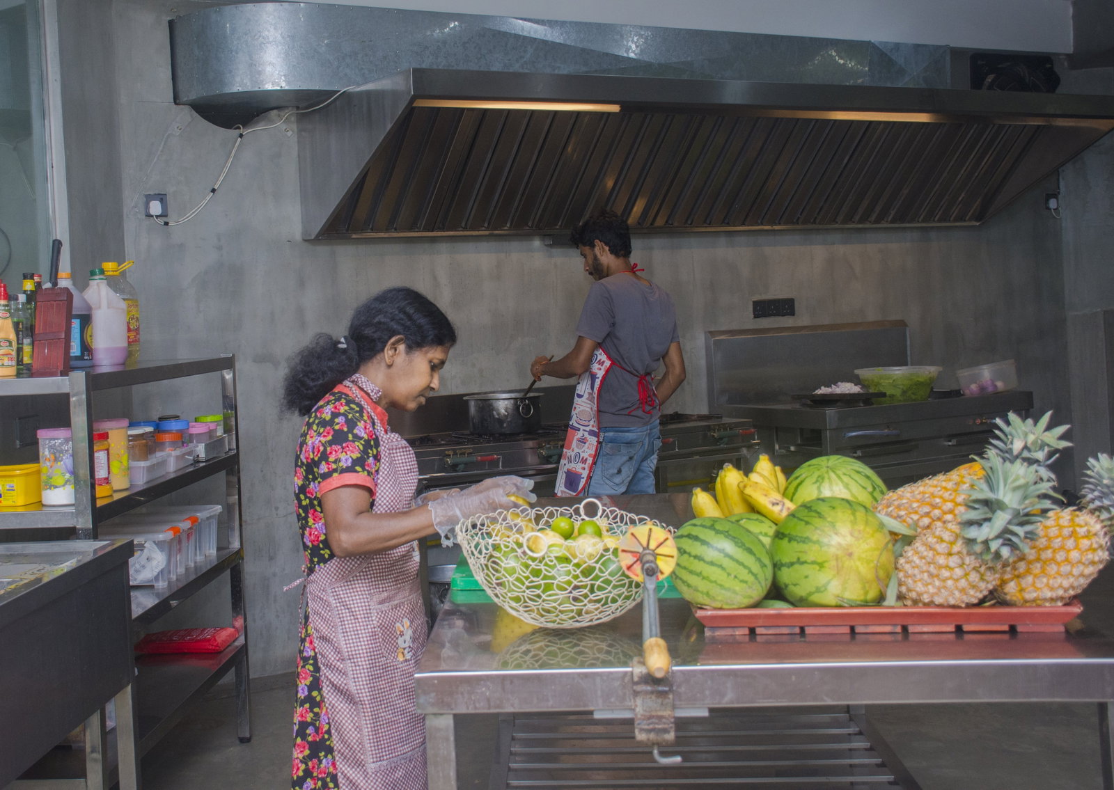 Person cutting up fruit in Volunteer house in Sri Lanka