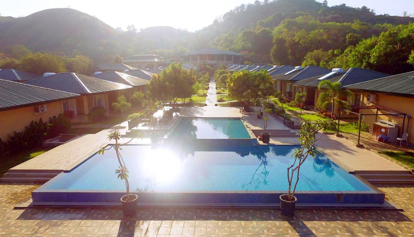 View of accommodation huts and hotel near pool at labuan bajo, Komodo Islands, Indonesia