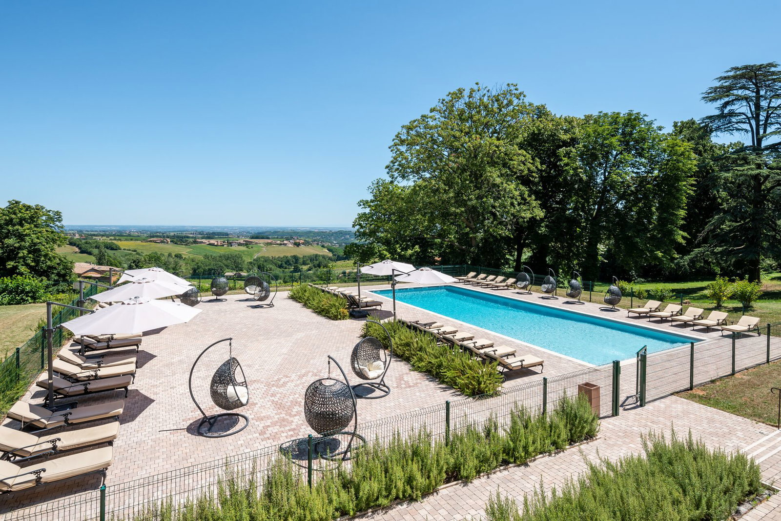 French chateau accommodation during the day with swimming pool