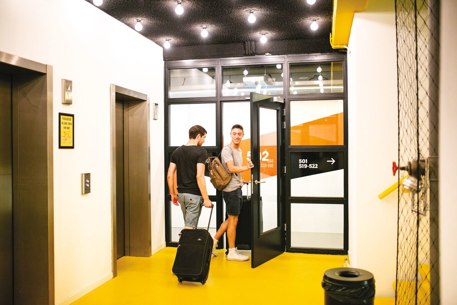 Travellers with suitcases in hostel in europe