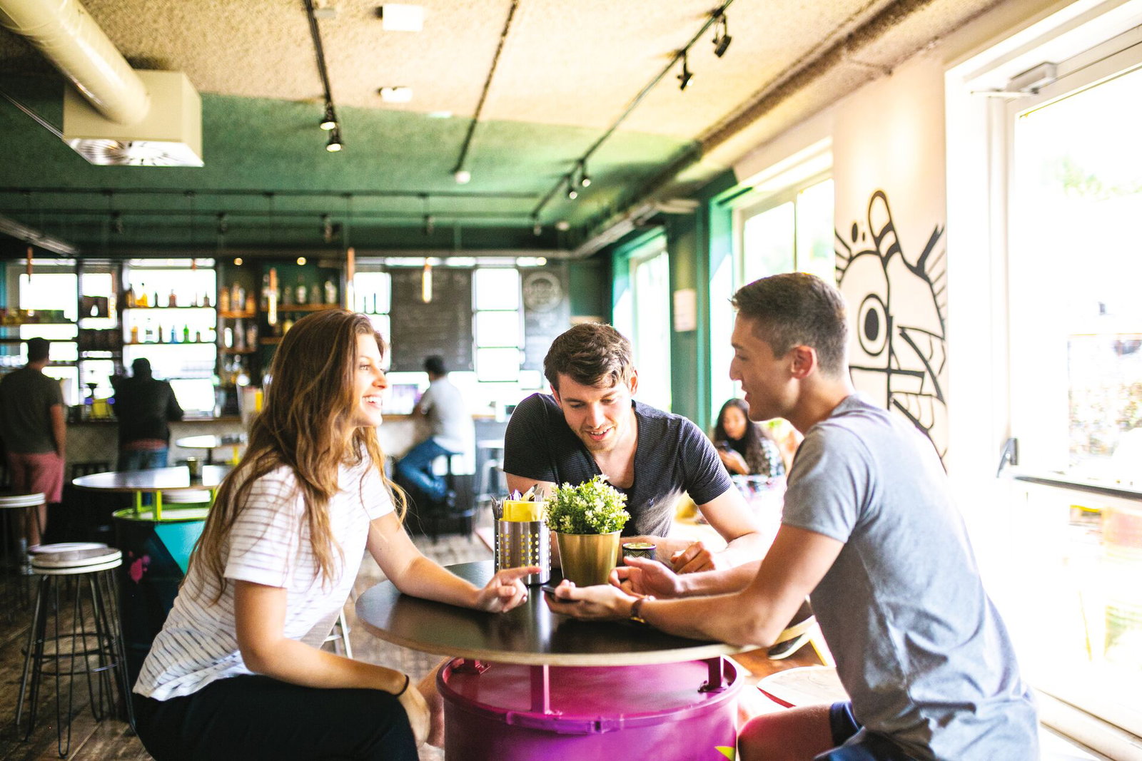 Travellers sitting in bar at hostel in europe