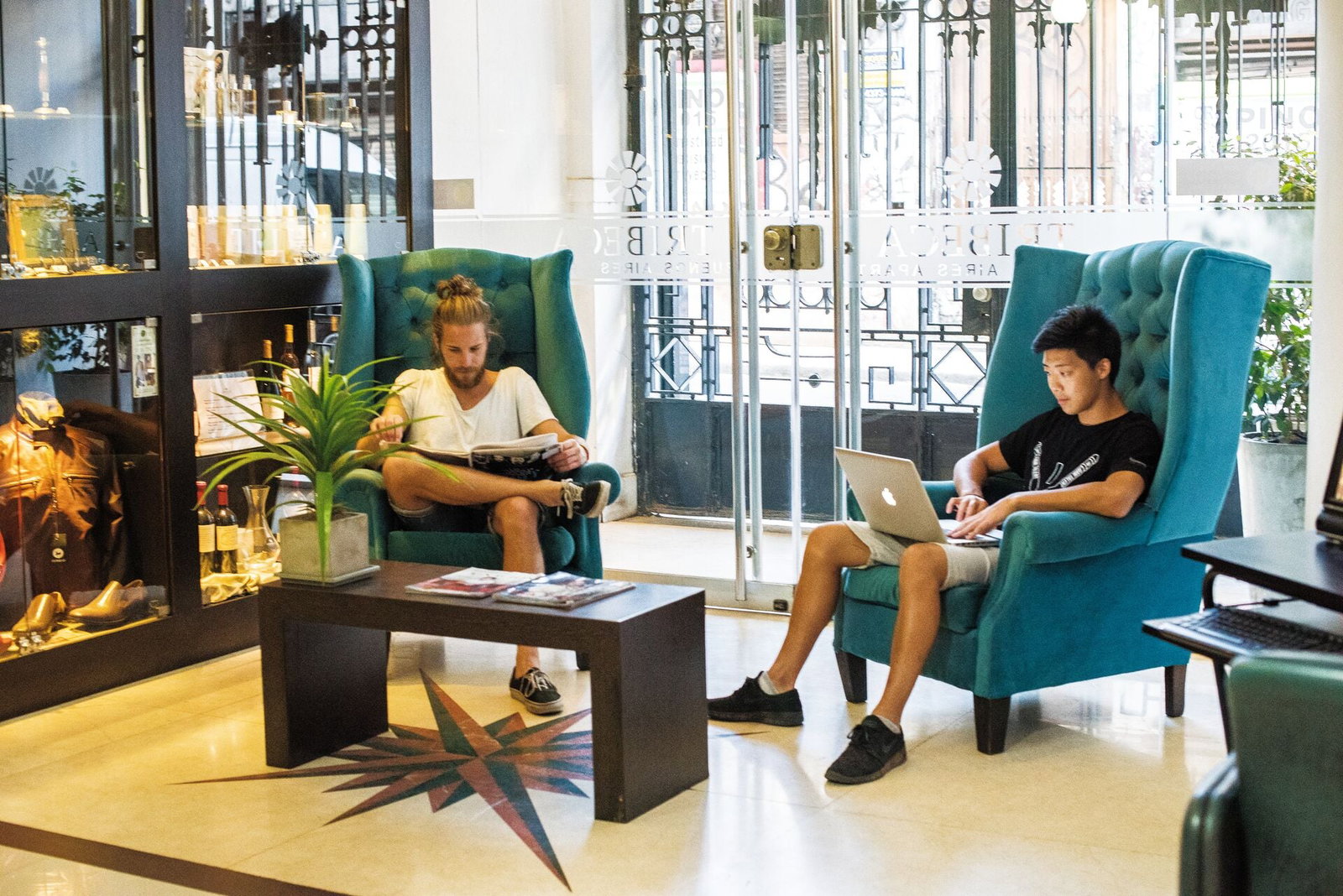 People chilling in common area in south america hotel