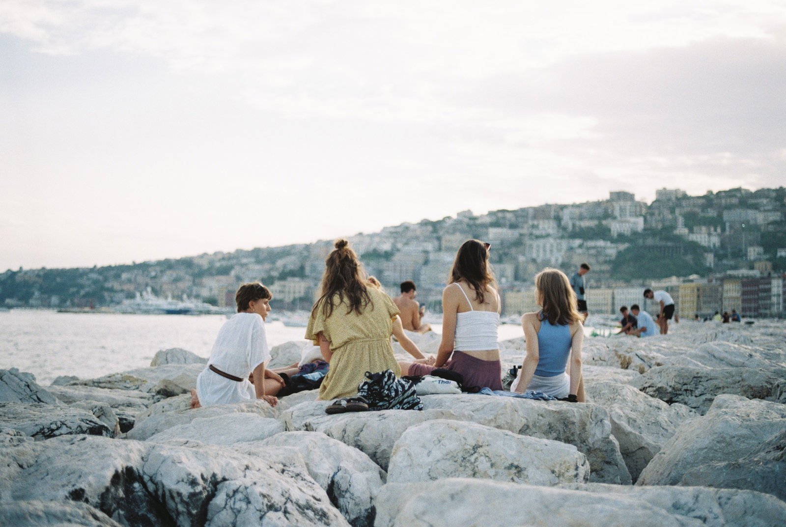 Group watching the sunset in Napoli, Italy 