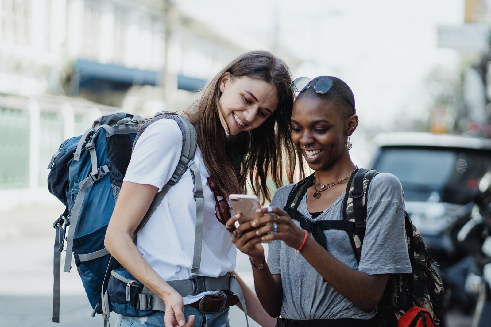 Two travellers looking at phone