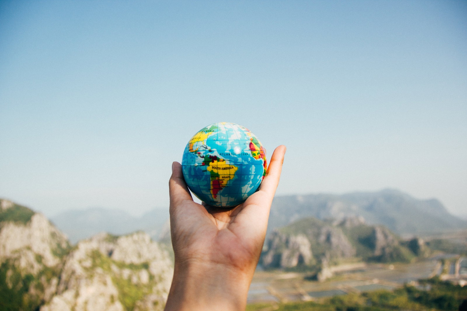 Hand holding a globe 
