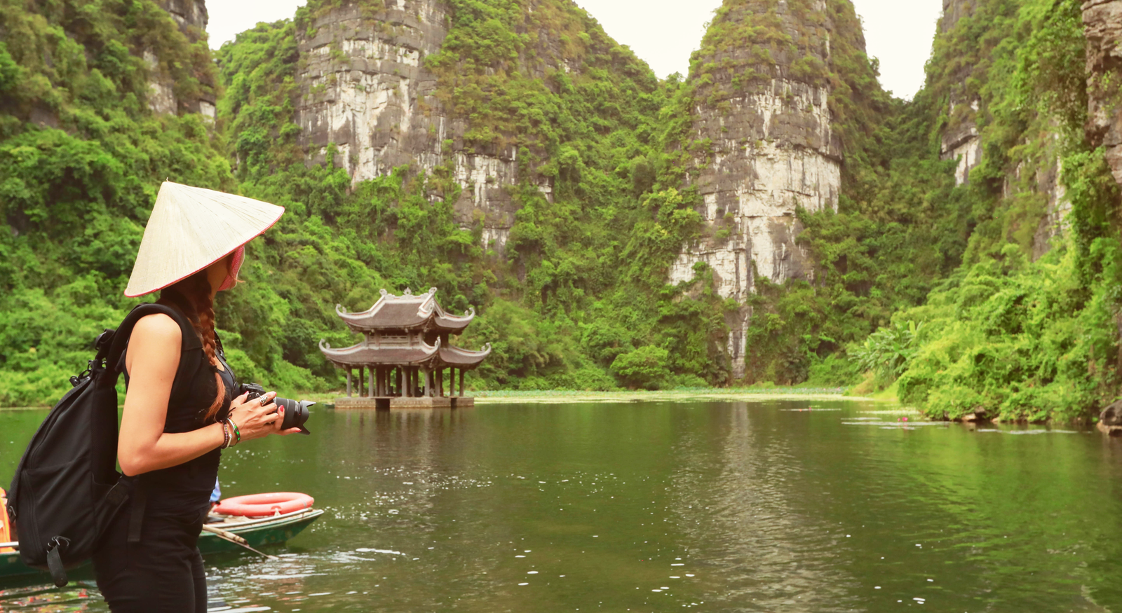 Woman looking over Ninh Binh lake in Vietnam