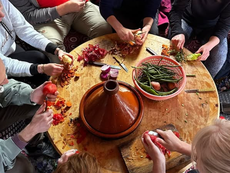 Group making a tagine together in Morocco