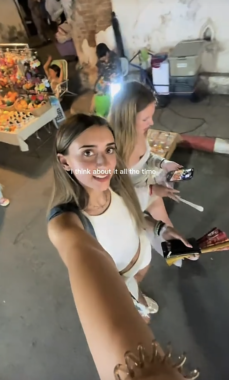 Travellers walking through night market in Thailand