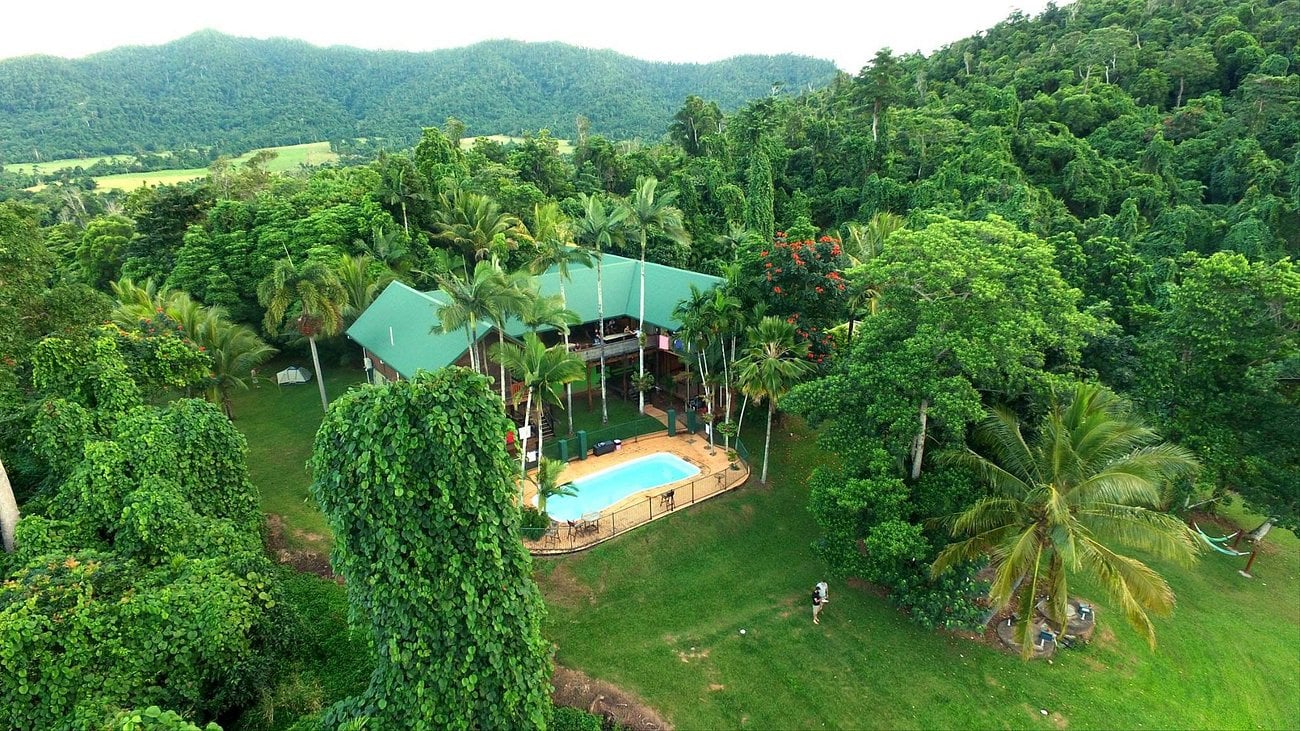 Aerial view of the Mission Beach Jackaroo Hostel surrounded by trees