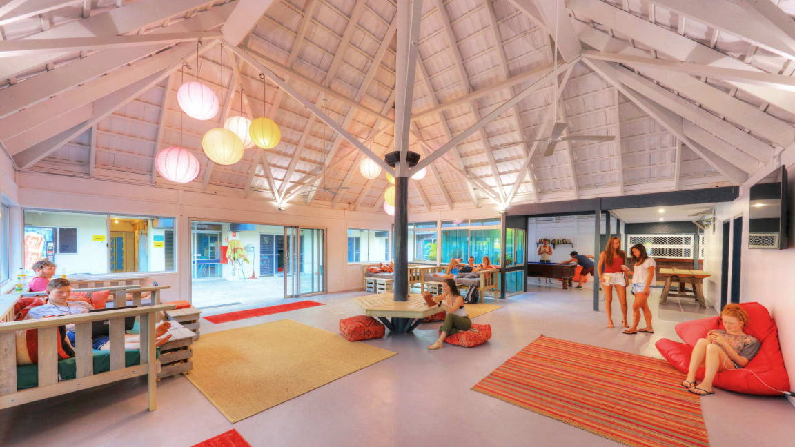 Common area of hostel accomodation with high ceilings