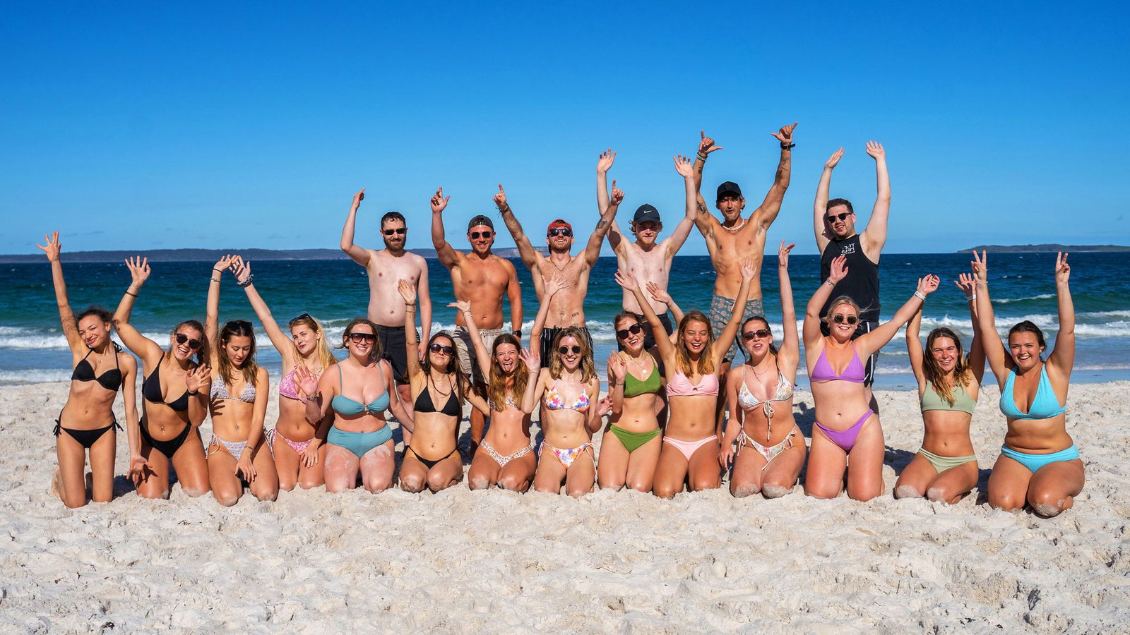 Group of travellers on beach in New South Wales